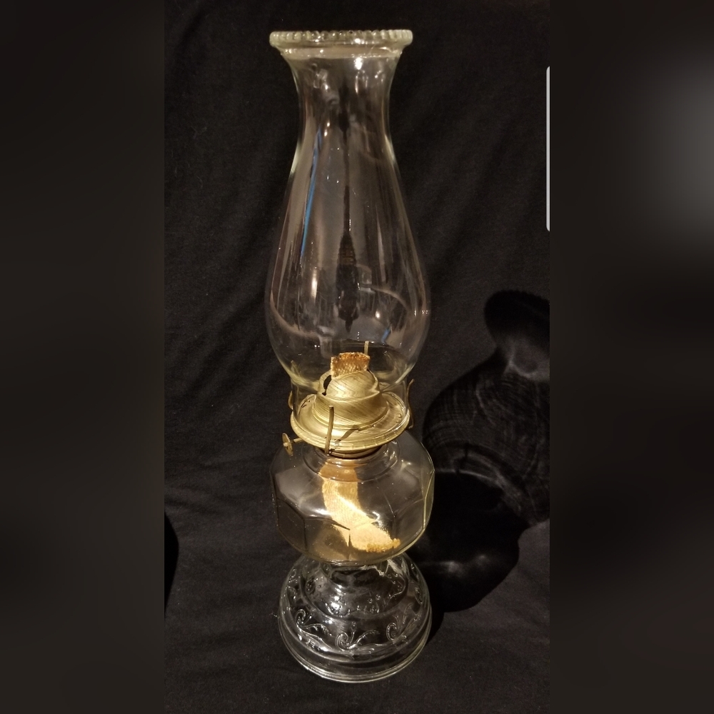 Vintage kerosene lamp with embossed base and decorative crown